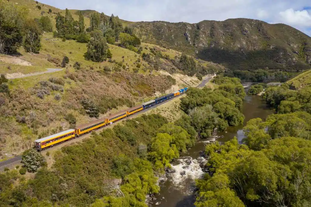 The Taieri Gorge Train carriages cross the viaduct.