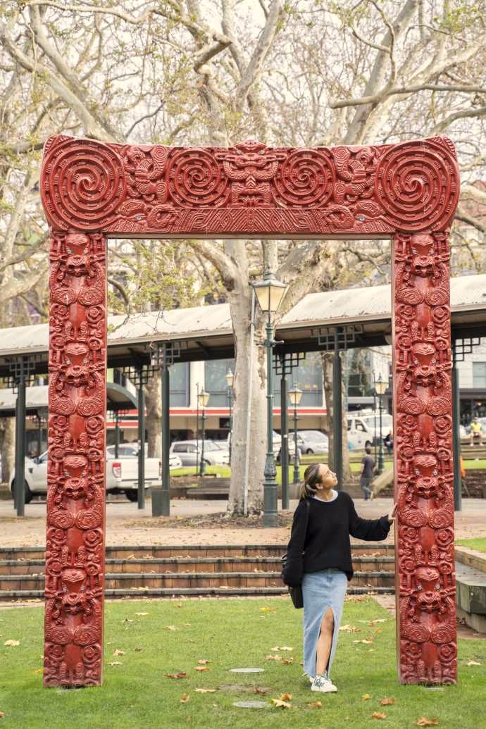 Street Art Trail Archway A young woman admires the Ko Te Tuhono gateway sculpture in the Octagon as she walks through it.