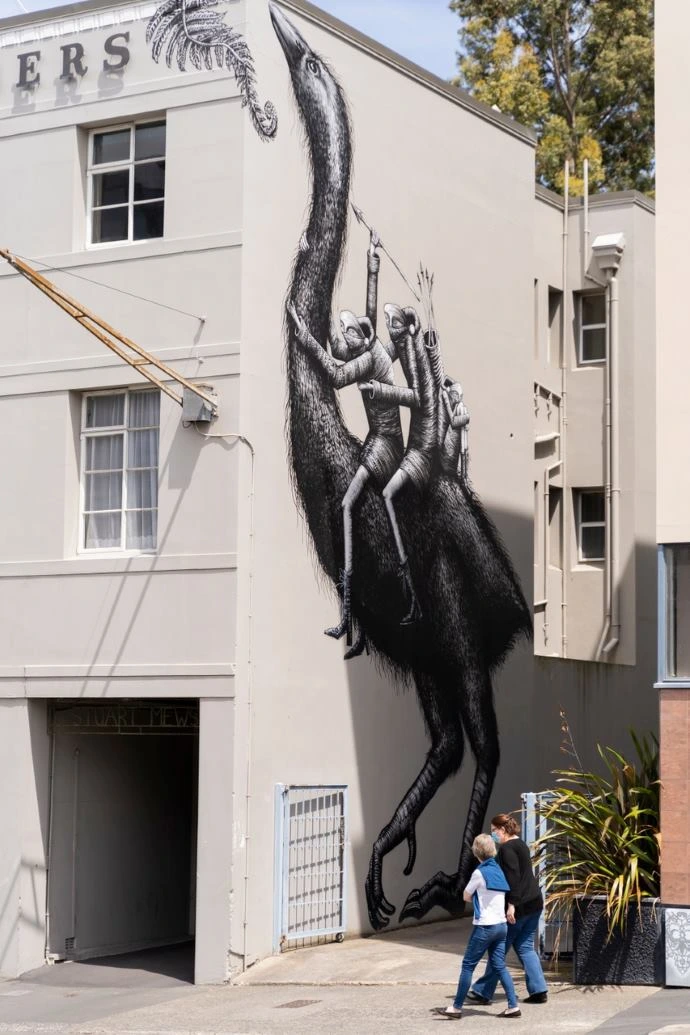 Street Art Trail Phlegm Street art by Phlegm depicts two creatures riding a moa.
