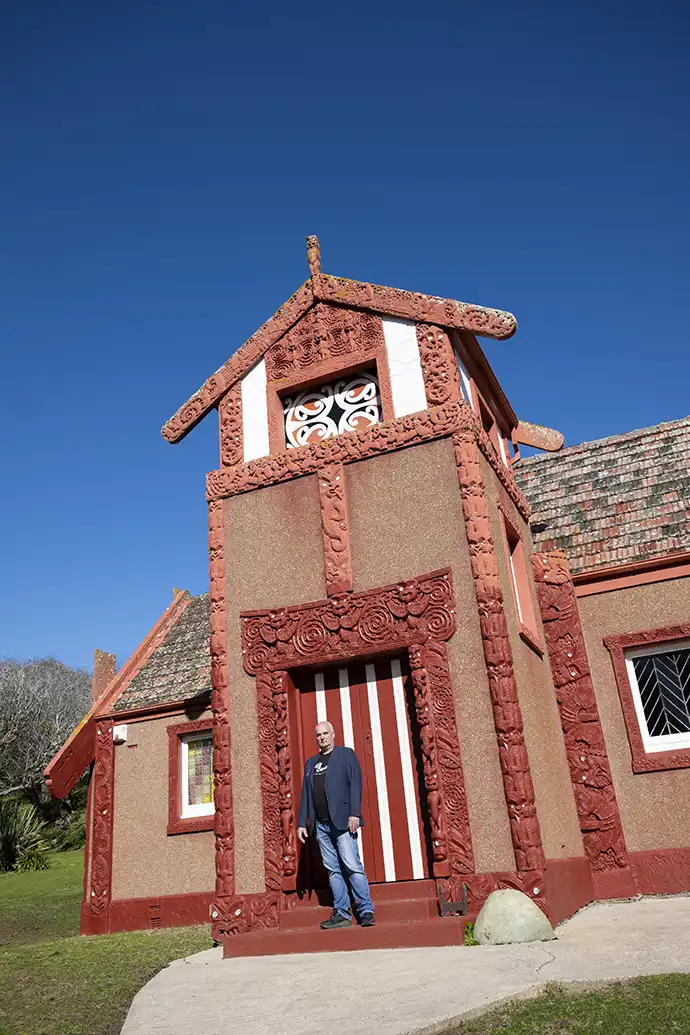 Hoani Langsbury outside Otakou Marae Hoani Langsbury standing on the steps at the entrance to Otakou Marae on a clear day