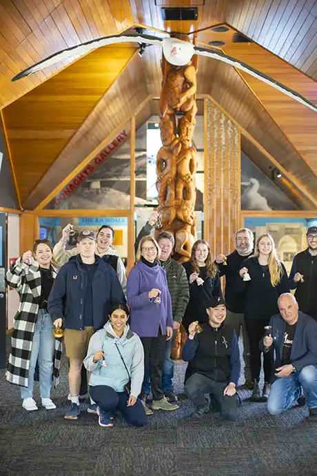 Ringing of the bells at the Albatross Centre Group of people ringing bells standing in front of the Donaghys Gallery at the Albatross Centre